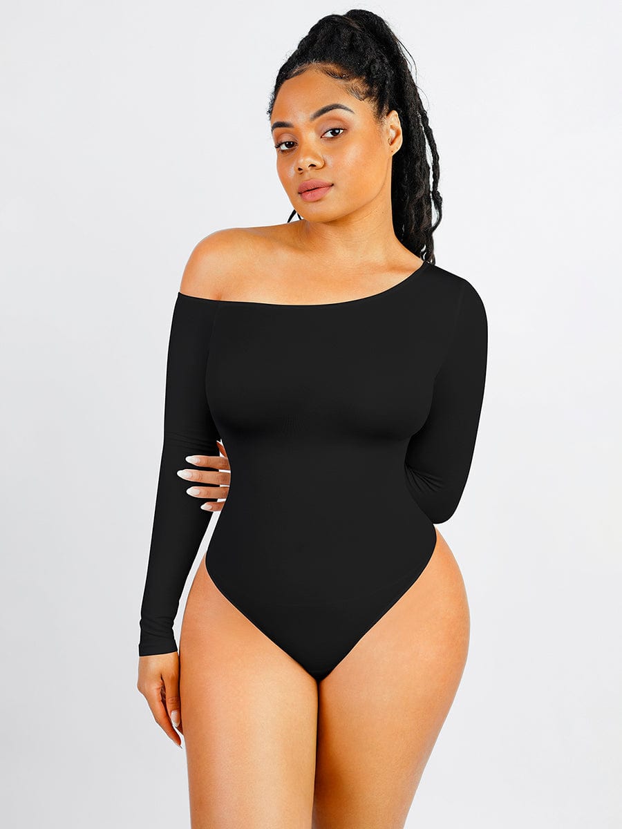 Woman wearing a black off-shoulder bodysuit on a gray background