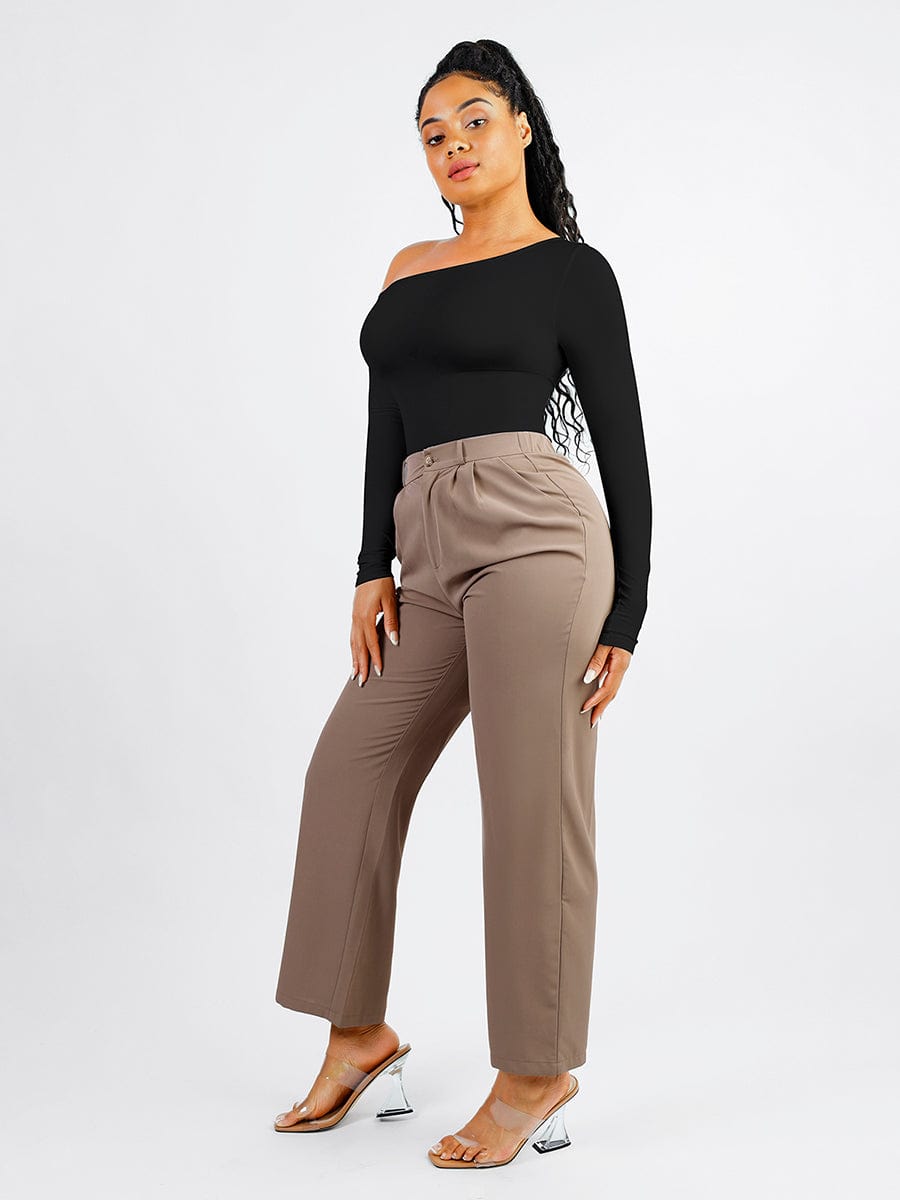 Woman wearing a black off-shoulder top and beige high-waisted pants on a white background