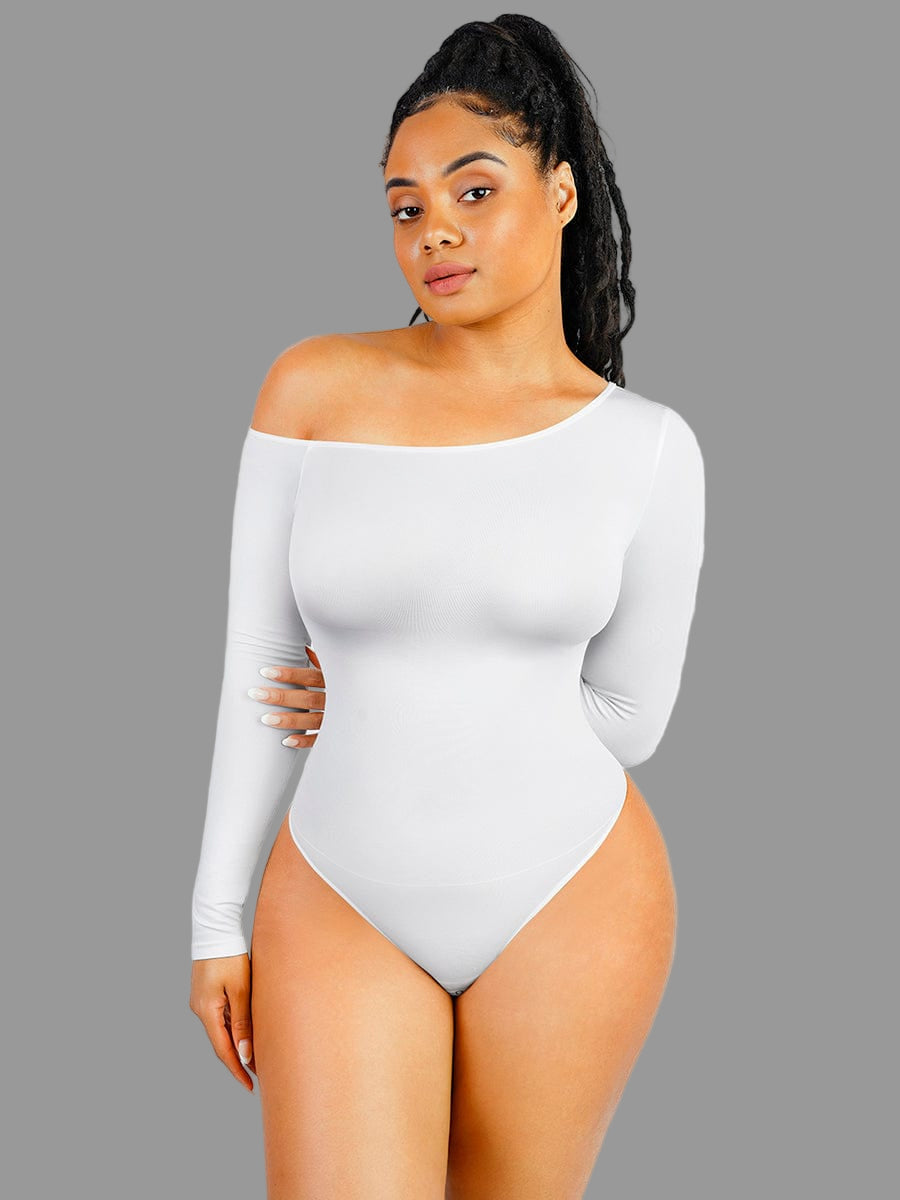 Woman wearing a white off-shoulder bodysuit against a plain background
