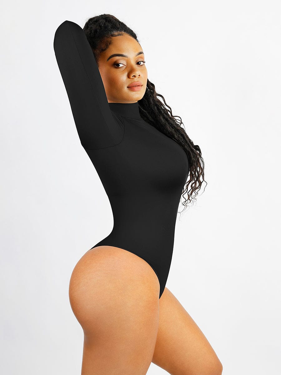 Person wearing a black bodysuit against a plain background