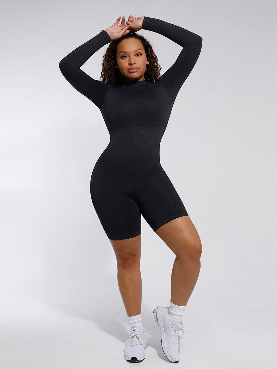 Person wearing a black bodysuit against a white background