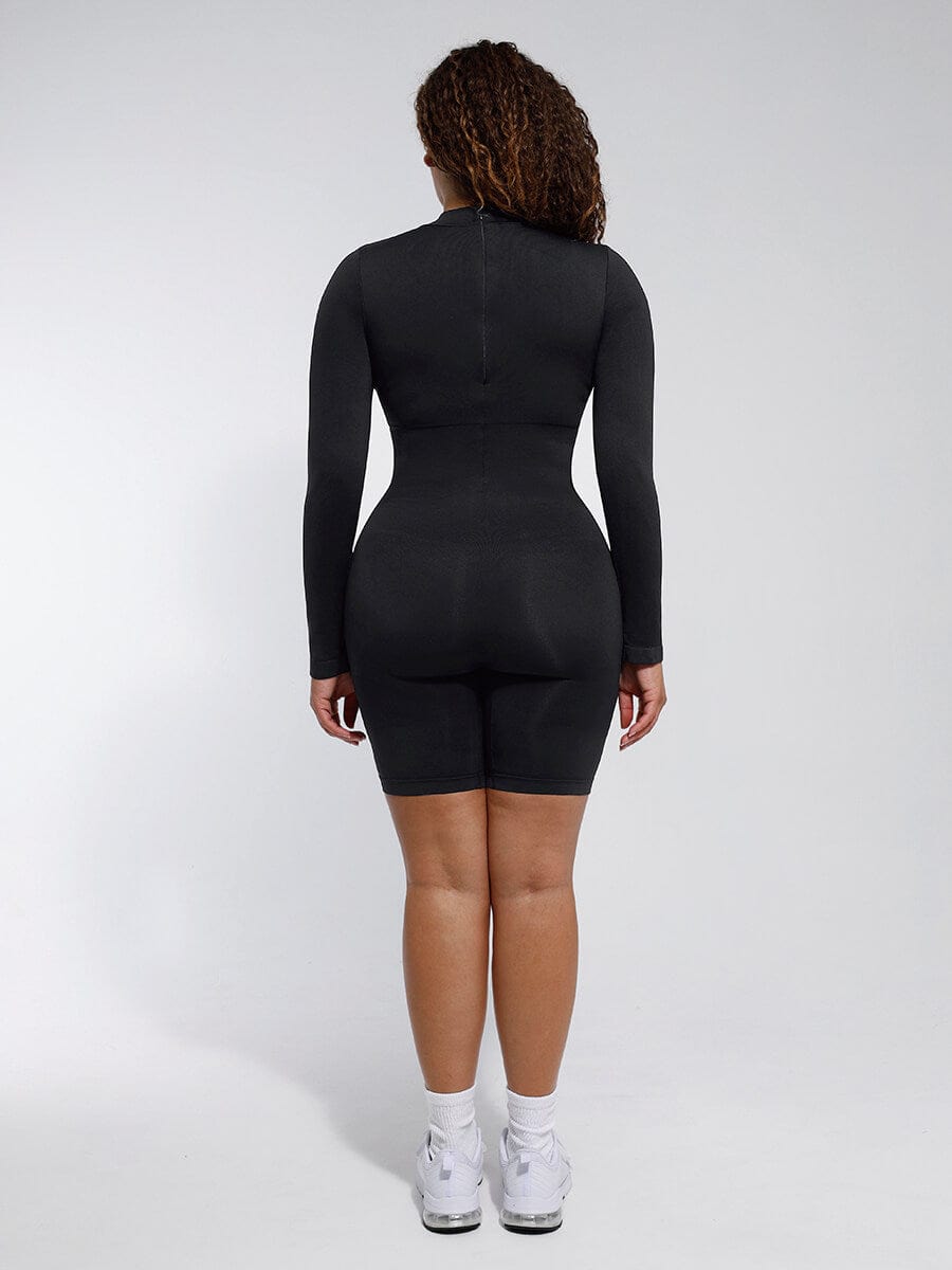Person wearing a black bodysuit against a white background