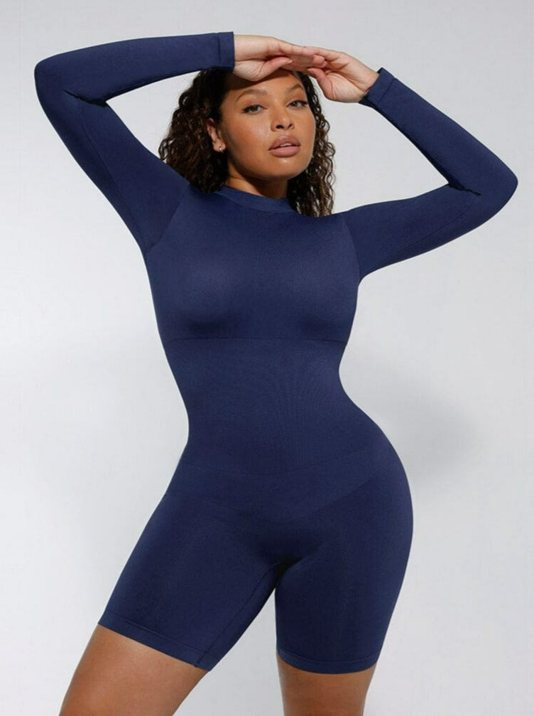 Person wearing a blue bodysuit against a white background