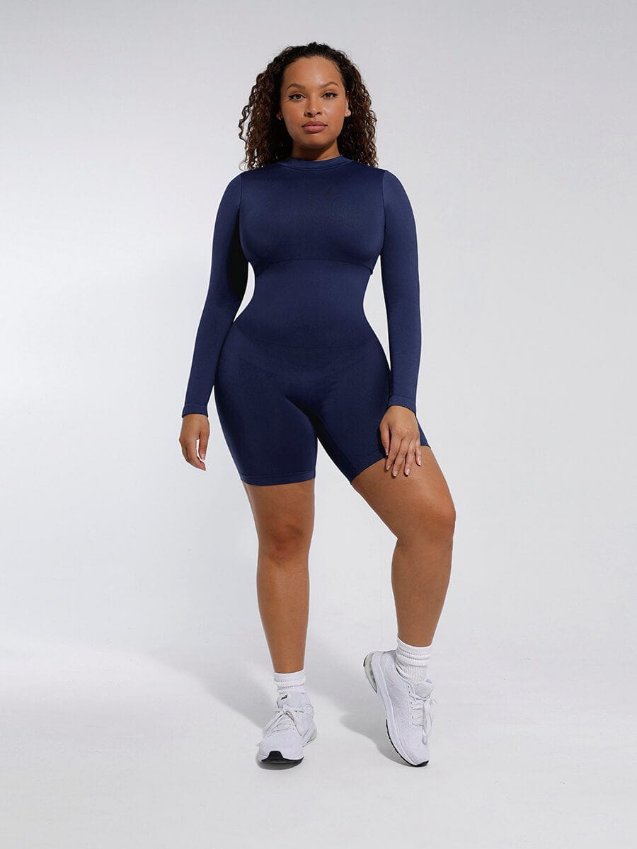 Person wearing a blue bodysuit against a white background